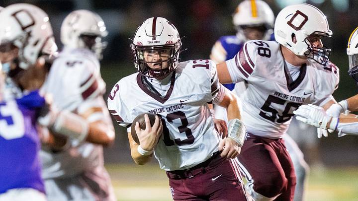 Dowling Catholic's Ethan La Cava (13) carries the ball up the field against Johnston on Sept. 4, 2026, at Johnston High School. Dowling Catholic's Ethan La Cava (13) carries the ball up the field against Johnston on Sept. 4, 2026, at Johnston High School.