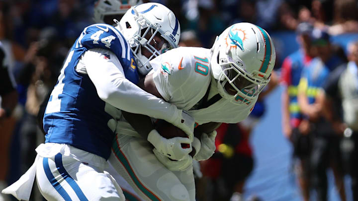 Sep 7, 2025; Indianapolis, Indiana, USA; Indianapolis Colts linebacker Zaire Franklin (44) tackles Miami Dolphins wide receiver Tyreek Hill (10) during the first quarter at Lucas Oil Stadium. Mandatory Credit: Trevor Ruszkowski-Imagn Images