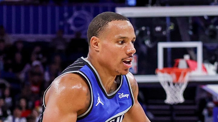 Houston Rockets forward Tari Eason drives around Orlando Magic guard Desmond Bane.