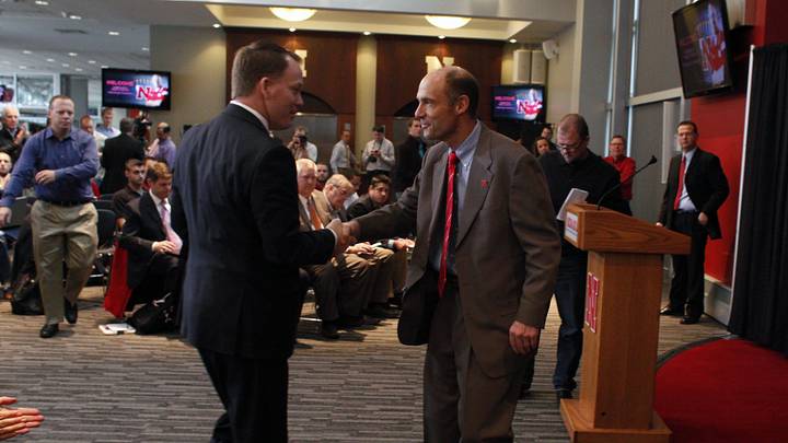 Dec 5, 2014; Lincoln, NE, USA; Nebraska Cornhuskers head coach Mike Riley (right) shakes hands with athletic director Shawn Eichorst at Memorial Stadium. Mandatory Credit: Bruce Thorson-Imagn Images