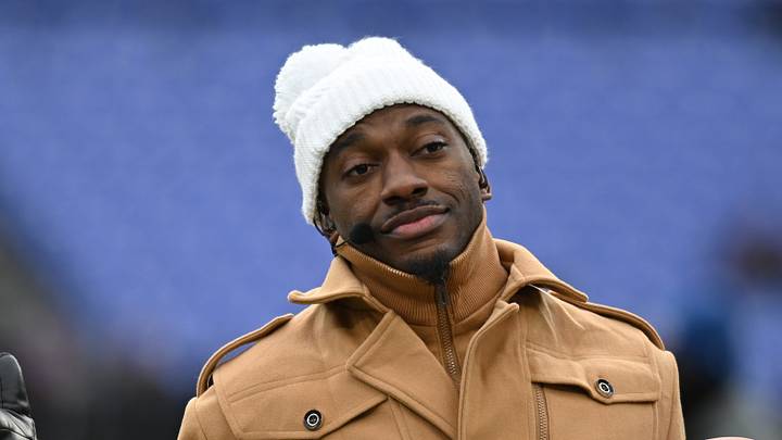 Jan 20, 2024; Baltimore, MD, USA; ESPN college football and NFL analyst Robert Griffin III reacts on the sidelines before a 2024 AFC divisional round game between the Houston Texans and the Baltimore Ravens at M&T Bank Stadium.
