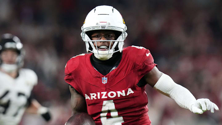 Arizona Cardinals receiver Greg Dortch (4) runs in for a touchdown after a catch against the Jacksonville Jaguars at State Farm Stadium on Nov. 23, 2025.