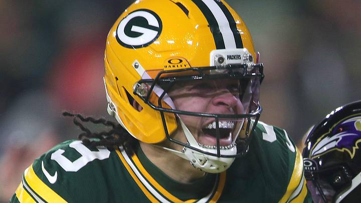 Green Bay Packers receiver Christian Watson reacts after catching a touchdown pass against Baltimore.