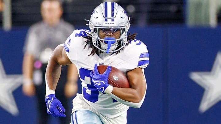 Aug 22, 2025; Arlington, Texas, USA; Dallas Cowboys running back Jaydon Blue (34) carries the ball during the fourth quarter against the Atlanta Falcons at AT&T Stadium.