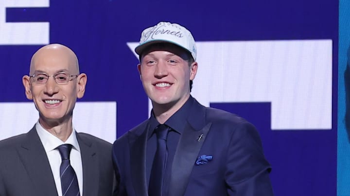 Jun 25, 2025; Brooklyn, NY, USA; Kon Knueppel stands with NBA commissioner Adam Silver after being selected as the fourth pick by the Charlotte Hornets in the first round of the 2025 NBA Draft at Barclays Center. Mandatory Credit: Brad Penner-Imagn Images Jun 25, 2025; Brooklyn, NY, USA; Kon Knueppel stands with NBA commissioner Adam Silver after being selected as the fourth pick by the Charlotte Hornets in the first round of the 2025 NBA Draft at Barclays Center. Mandatory Credit: Brad Penner-Imagn Images