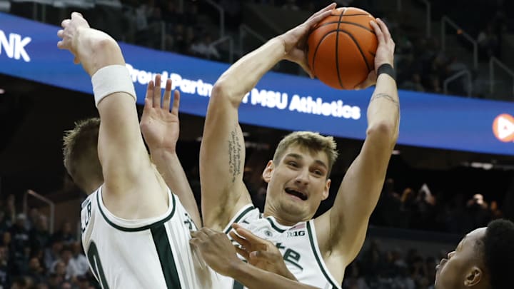 Michigan State Spartans center Carson Cooper leaps and grabs a rebound against the Iowa Hawkeyes on Tuesday, Dec. 2, 2025, at the Breslin Center. Michigan State Spartans center Carson Cooper leaps and grabs a rebound against the Iowa Hawkeyes on Tuesday, Dec. 2, 2025, at the Breslin Center.