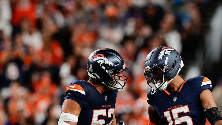 Sep 29, 2025; Denver, Colorado, USA; Denver Broncos linebacker Nik Bonitto (15) celebrates with Denver Broncos linebacker Jonah Elliss (52) after sacking Cincinnati Bengals quarterback Jake Browning (6) (not pictured) during the third quarter at Empower Field at Mile High. 