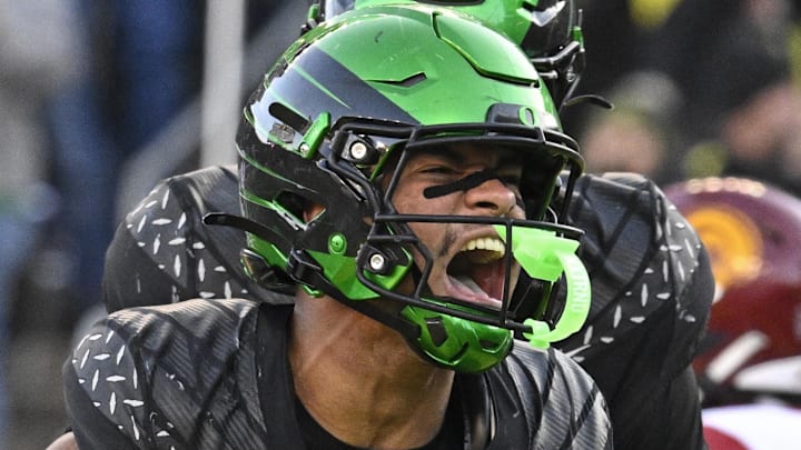 Nov 22, 2025; Eugene, Oregon, USA; Oregon Ducks tight end Kenyon Sadiq (18) celebrates against the Southern California Trojans during the second half at Autzen Stadium. Mandatory Credit: Troy Wayrynen-Imagn Images