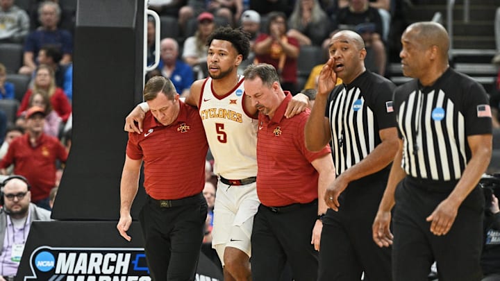 Mar 20, 2026; St. Louis, MO, USA; Iowa State Cyclones forward Joshua Jefferson (5) is helped off of the court after suffering an apparent injury to his left leg while shooting a layup against Tennessee State Tigers forward Jalen Pitre (not pictured) during the first half of a first round game of the men's 2026 NCAA Tournament at Enterprise Center.