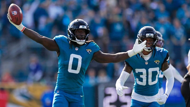 Jacksonville Jaguars linebacker Devin Lloyd (0) reacts to a fumble recovery next to cornerback Montaric Brown (30) during the second quarter of an NFL football AFC Wild Card playoff matchup, Sunday, Jan. 11, 2026, in Jacksonville, Fla. The Bills defeated the Jaguars 27-24. [Corey Perrine/Florida Times-Union]