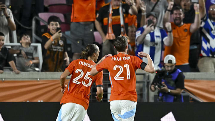 Jul 19, 2025; Houston, Texas, USA; Houston Dynamo FC midfielder Jack McGlynn (21) runs towards the fans to celebrate his goal in the first half against the Philadelphia Union at Shell Energy Stadium. Mandatory Credit: Maria Lysaker-Imagn Images 