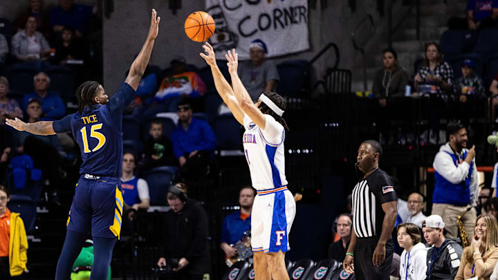 Dec 30, 2023; Gainesville, Florida, USA; Quinnipiac Bobcats forward Amarri Tice (15) defends a three