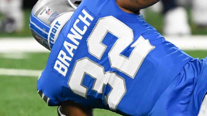Sep 14, 2025; Detroit, Michigan, USA; Chicago Bears wide receiver Rome Odunze (15) fumbles the ball defended by Detroit Lions safety Brian Branch (32) during the second quarter of the game at Ford Field. Mandatory Credit: Lon Horwedel-Imagn Images