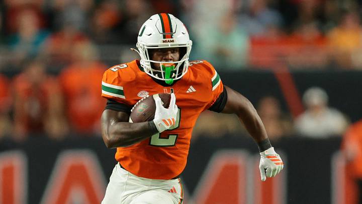 Oct 17, 2025; Miami Gardens, Florida, USA; Miami Hurricanes running back Jordan Lyle (2) carries the football against the Louisville Cardinals during the fourth quarter at Hard Rock Stadium. Mandatory Credit: Sam Navarro-Imagn Images Oct 17, 2025; Miami Gardens, Florida, USA; Miami Hurricanes running back Jordan Lyle (2) carries the football against the Louisville Cardinals during the fourth quarter at Hard Rock Stadium. Mandatory Credit: Sam Navarro-Imagn Images