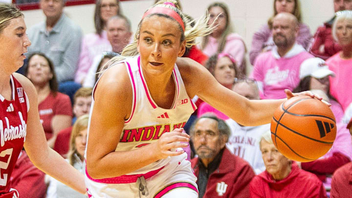 Indiana's Sydney Parrish (33) drives around the Nebraska defense at Simon Skjodt Assembly Hall.