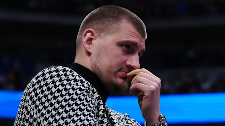 Jan 29, 2026; Denver, Colorado, USA; Denver Nuggets center Nikola Jokic (15) watches game play in the fourth quarter against the Brooklyn Nets at Ball Arena. Mandatory Credit: Ron Chenoy-Imagn Images