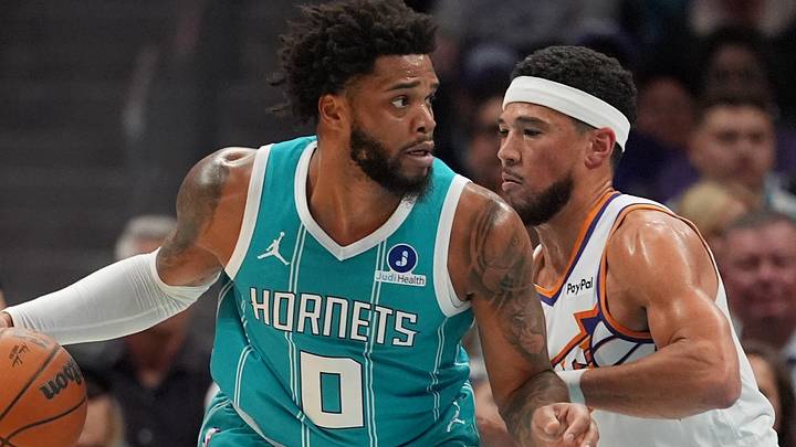 Apr 2, 2026; Charlotte, North Carolina, USA; Charlotte Hornets forward Miles Bridges (0) works the ball against Phoenix Suns guard Devin Booker (1)during the first quarter at Spectrum Center. Mandatory Credit: Jim Dedmon-Imagn Images Apr 2, 2026; Charlotte, North Carolina, USA; Charlotte Hornets forward Miles Bridges (0) works the ball against Phoenix Suns guard Devin Booker (1)during the first quarter at Spectrum Center. Mandatory Credit: Jim Dedmon-Imagn Images