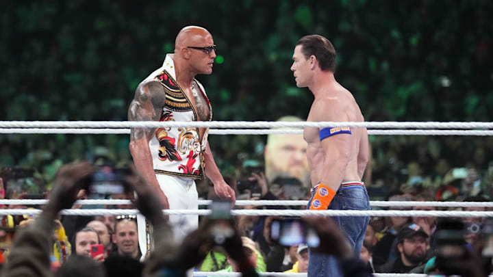 Apr 7, 2024; Philadelphia, PA, USA; The Rock and John Cena interfere during the WWE Universal Championship match between Roman Reigns and Cody Rhodes during Wrestlemania XL Sunday at Lincoln Financial Field. Mandatory Credit: Joe Camporeale-Imagn Images