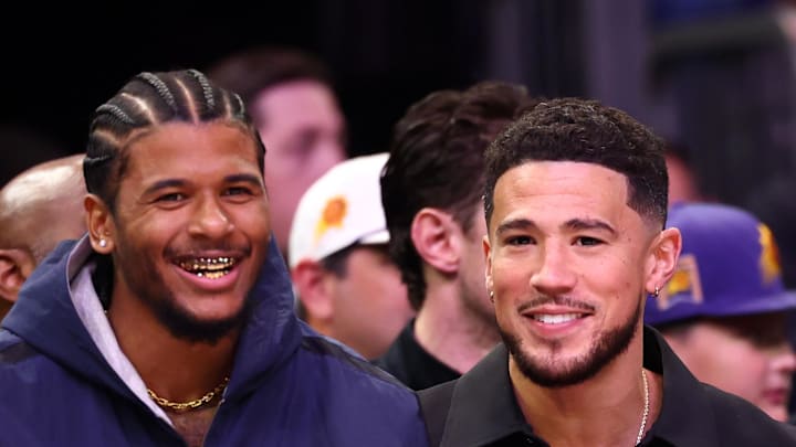 Feb 1, 2026; Phoenix, Arizona, USA; Phoenix Suns injured guards Jalen Green (left) and Devin Booker against the Los Angeles Clippers in the first half at Mortgage Matchup Center. Mandatory Credit: Mark J. Rebilas-Imagn Images
