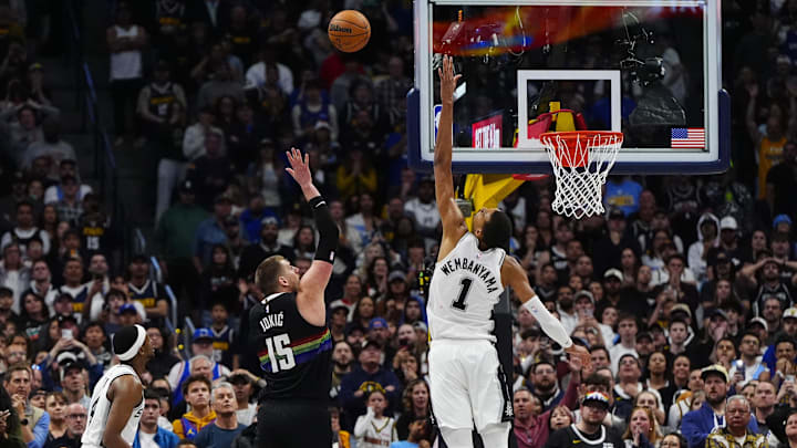 Nuggets center Nikola Jokić shoots the ball over Spurs forward Victor Wembanyama in overtime of Denver’s win. Nuggets center Nikola Jokić shoots the ball over Spurs forward Victor Wembanyama in overtime of Denver’s win.