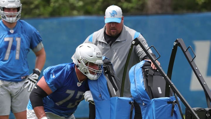 Detroit Lions offensive lineman Jonah Jackson goes through drills with assistant coach Hank Fraley during OTA practice Thursday, June 3, 2021, at the Allen Park practice facility.

Liions