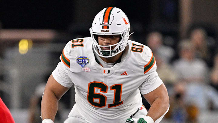 Dec 31, 2025; Arlington, TX, USA; Miami Hurricanes offensive lineman Francis Mauigoa (61) blocks the rush during the 2025 Cotton Bowl and quarterfinal game of the College Football Playoff at AT&T Stadium. Mandatory Credit: Jerome Miron-Imagn Images