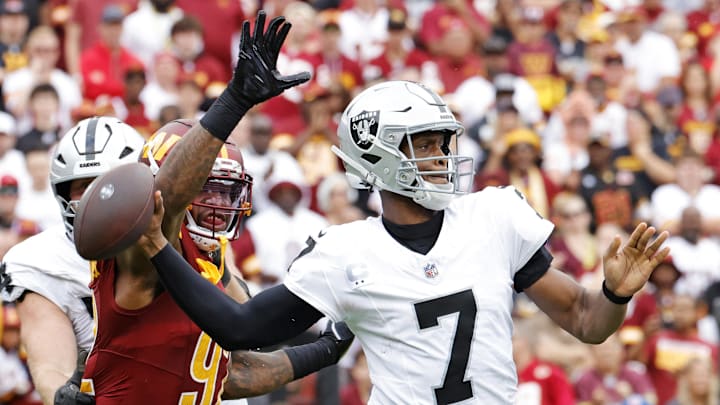 Sep 21, 2025; Landover, Maryland, USA; Las Vegas Raiders quarterback Geno Smith (7) drops back to make a pass during the first half against the Washington Commanders at Northwest Stadium. Mandatory Credit: Amber Searls-Imagn Images