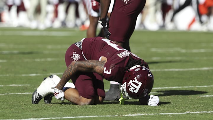 Nov 15, 2025; College Station, Texas, USA; Texas A&M Aggies wide receiver Ashton Bethel-Roman (3) holds his leg after an apparent injury during the third quarter against the South Carolina Gamecocks at Kyle Field. Mandatory Credit: Troy Taormina-Imagn Images Nov 15, 2025; College Station, Texas, USA; Texas A&M Aggies wide receiver Ashton Bethel-Roman (3) holds his leg after an apparent injury during the third quarter against the South Carolina Gamecocks at Kyle Field. Mandatory Credit: Troy Taormina-Imagn Images