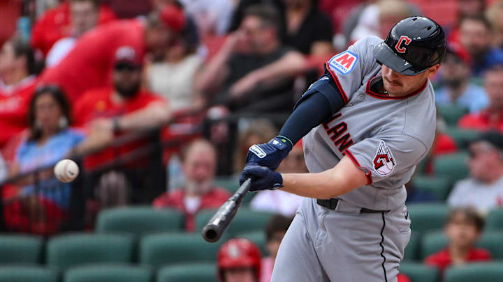 Apr 15, 2026; St. Louis, Missouri, USA; Cleveland Guardians first baseman Kyle Manzardo (9) hits a one run single against the St. Louis Cardinals during the first inning at Busch Stadium. Players and coaches are wearing number 42 in recognition of Jackie Robinson Day. Mandatory Credit: Jeff Curry-Imagn Images