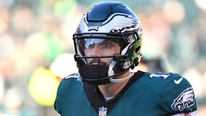 Philadelphia Eagles backup quarterback Ian Book stands on the field.