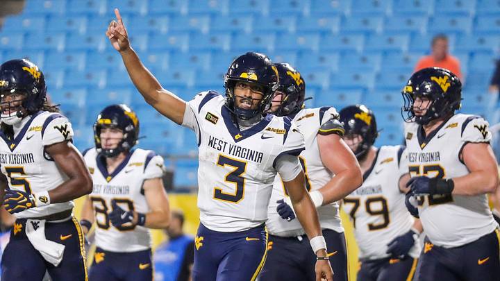 Sep 19, 2026; Charlotte, North Carolina, USA; West Virginia Mountaineers quarterback Michael Hawkins Jr. (3) celebrates after a touchdown during the second quarter Virginia Cavaliers at Bank of America Stadium. Mandatory Credit: Ben Queen-Imagn Images
