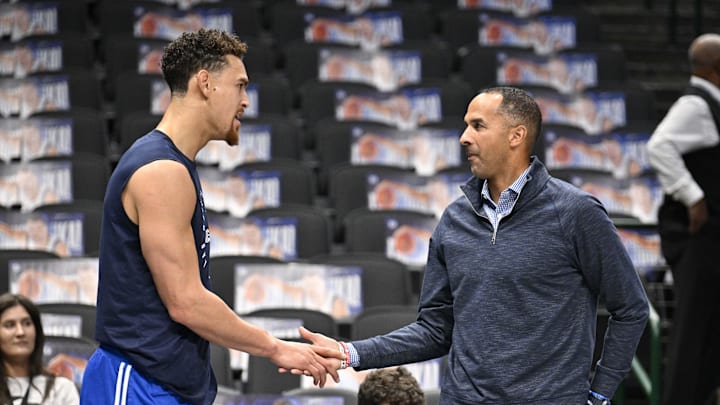Nov 3, 2024; Dallas, Texas, USA; Dallas Mavericks center Dwight Powell (left) speaks with Mavericks general manager Nico Harrison (right) before the game between the Dallas Mavericks and the Orlando Magic at American Airlines Center. Mandatory Credit: Jerome Miron-Imagn Images