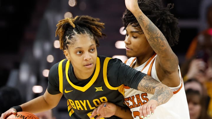 Dec 14, 2025; Fort Worth, Texas, USA; Baylor Bears guard Taliah Scott (0) looks to pass as Texas Longhorns guard Rori Harmon (3) defends during the first half at Dickies Arena. Mandatory Credit: Chris Jones-Imagn Images Dec 14, 2025; Fort Worth, Texas, USA; Baylor Bears guard Taliah Scott (0) looks to pass as Texas Longhorns guard Rori Harmon (3) defends during the first half at Dickies Arena. Mandatory Credit: Chris Jones-Imagn Images