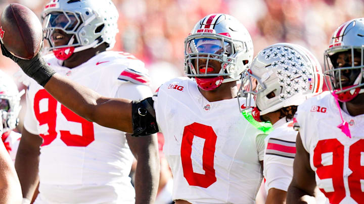 Ohio State Buckeyes linebacker Sonny Styles celebrates after intercepting a pass in the first half at Camp Randall Stadium