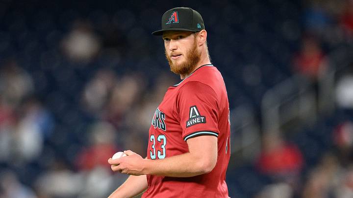 Apr 4, 2025; Washington, District of Columbia, USA; Arizona Diamondbacks pitcher A.J. Puk (33) looks on during the eighth inning against the Washington Nationals at Nationals Park. Mandatory Credit: Reggie Hildred-Imagn Images