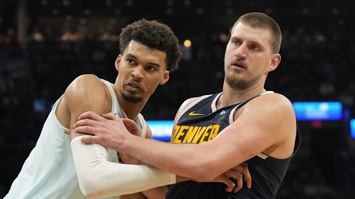 Jan 4, 2025; San Antonio, Texas, USA; San Antonio Spurs center Victor Wembanyama (1) and Denver Nuggets center Nikola Jokic (15) battle for position during an inbound pass in the second half at Frost Bank Center. Mandatory Credit: Scott Wachter-Imagn Images
