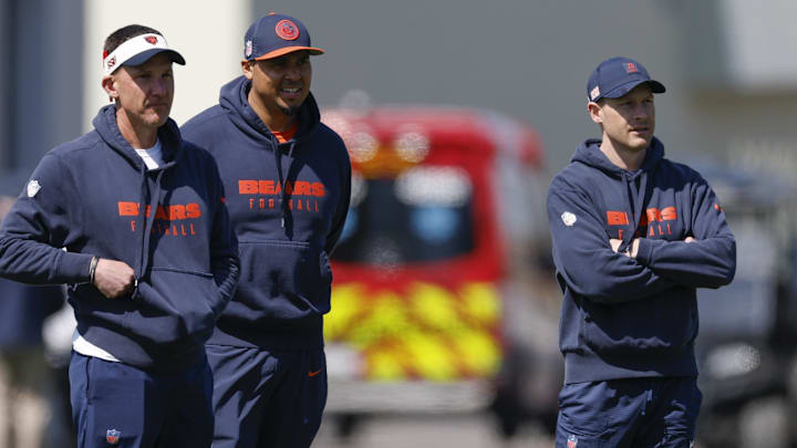 Dennis Allen, Ryan Poles and Ben Johnson look on during a Bears spring practice. 