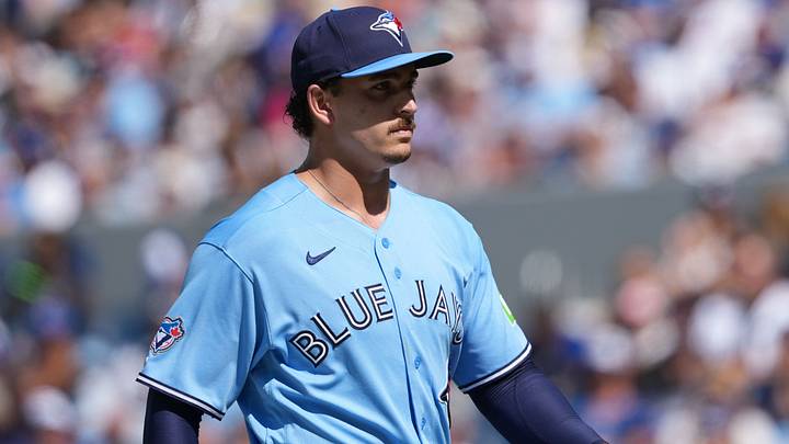 Toronto Blue Jays relief pitcher Ricky Tiedemann (33) walks back to the dugout. Toronto Blue Jays relief pitcher Ricky Tiedemann (33) walks back to the dugout.
