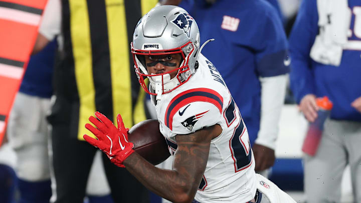 Aug 21, 2025; East Rutherford, New Jersey, USA; New England Patriots linebacker Harold Landry III (2) gains yards after catch during the first half against the New York Giants at MetLife Stadium. Mandatory Credit: Vincent Carchietta-Imagn Images