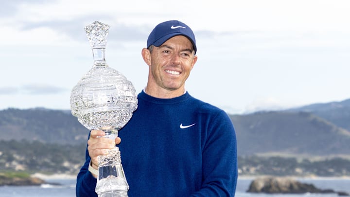Rory McIlroy hoists the trophy following the final round of the 2025 AT&T Pebble Beach Pro-Am