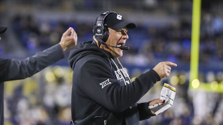 Oct 25, 2025; Morgantown, West Virginia, USA; West Virginia Mountaineers head coach Rich Rodriguez calls out a play during the third quarter against the Texas Christian University Horned Frogs at Milan Puskar Stadium. Mandatory Credit: Ben Queen-Imagn Images Oct 25, 2025; Morgantown, West Virginia, USA; West Virginia Mountaineers head coach Rich Rodriguez calls out a play during the third quarter against the Texas Christian University Horned Frogs at Milan Puskar Stadium. Mandatory Credit: Ben Queen-Imagn Images