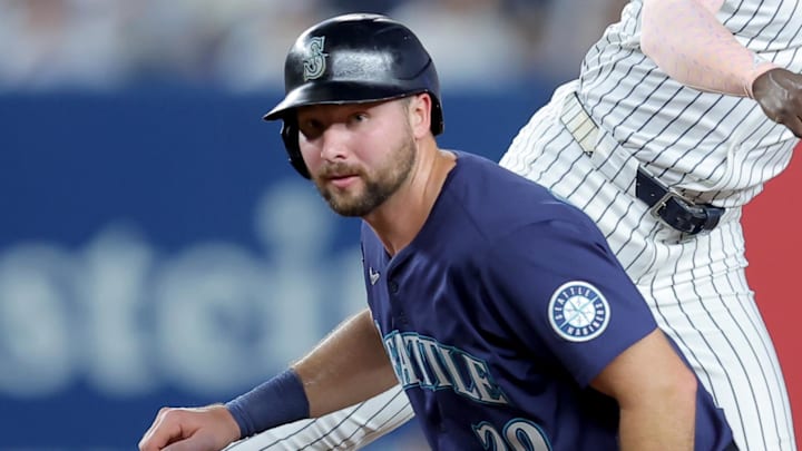 Cal Raleigh tries to break up a double play on July 8. 