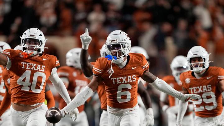 Texas Longhorns defensive back Kobe Black (6) and teammates react after making an interception during the second half against the Texas A&M Aggies at Darrell K Royal-Texas Memorial Stadium. Texas Longhorns defensive back Kobe Black (6) and teammates react after making an interception during the second half against the Texas A&M Aggies at Darrell K Royal-Texas Memorial Stadium.