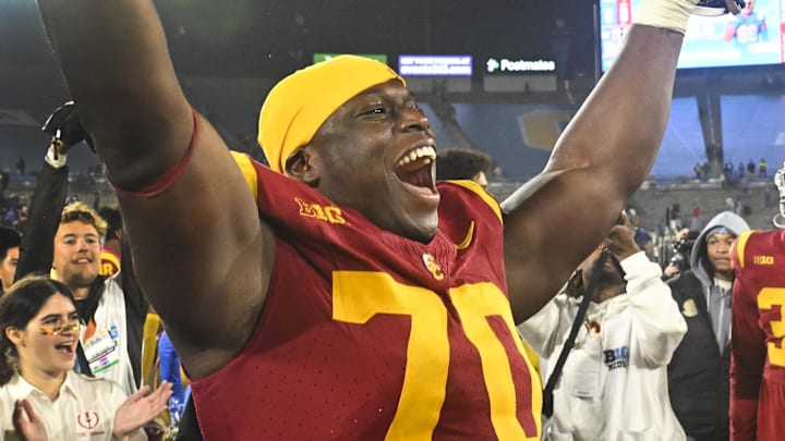 Nov 23, 2024; Pasadena, California, USA;  USC Trojans offensive lineman Emmanuel Pregnon (70) celebrates the Trojans win over UCLA Bruins at Rose Bowl. Mandatory Credit: Robert Hanashiro-Imagn Images