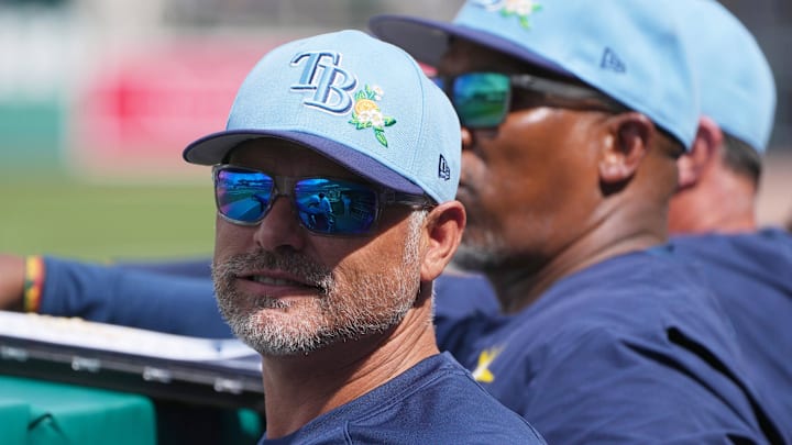 Feb 26, 2026; Fort Myers, Florida, USA; Tampa Bay Rays manager Kevin Cash looks on from the dugout during the fourth inning against the Boston Red Sox at JetBlue Park at Fenway South. 