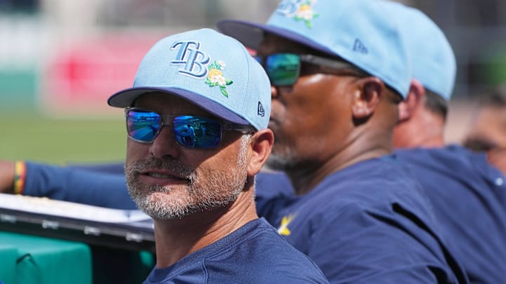 Feb 26, 2026; Fort Myers, Florida, USA; Tampa Bay Rays manager Kevin Cash looks on from the dugout during the fourth inning against the Boston Red Sox at JetBlue Park at Fenway South. 