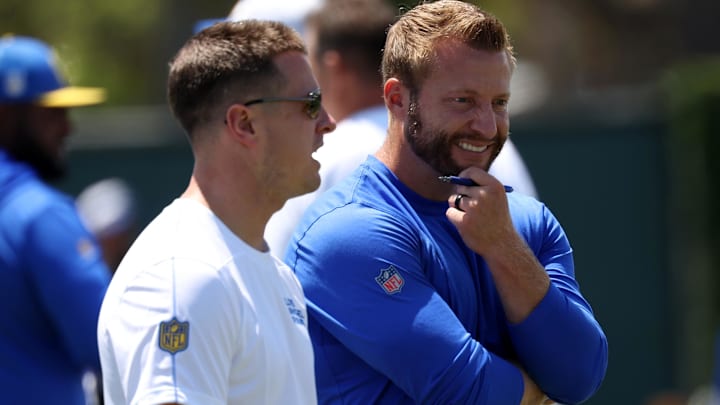 Jul 31, 2024; Los Angeles, CA, USA;  Los Angeles Rams head coach Sean McVay (right) talks with offensive coordinator Mike LaFleur (left) during training camp at Loyola Marymount University. Mandatory Credit: Kiyoshi Mio-Imagn Images