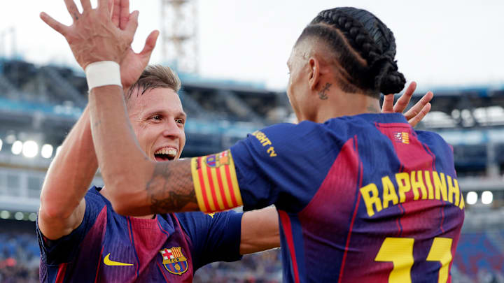 Dani Olmo (left) scored Barcelona’s game-winner from a Raphinha assist.