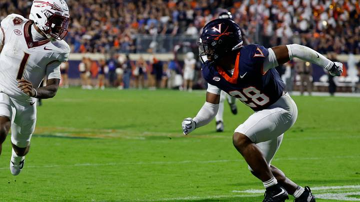 Sep 26, 2025; Charlottesville, Virginia, USA; Florida State Seminoles quarterback Tommy Castellanos (1) runs with the ball as Virginia Cavaliers defensive back Donavon Platt (28) chases at Scott Stadium. Mandatory Credit: Geoff Burke-Imagn Images Sep 26, 2025; Charlottesville, Virginia, USA; Florida State Seminoles quarterback Tommy Castellanos (1) runs with the ball as Virginia Cavaliers defensive back Donavon Platt (28) chases at Scott Stadium. Mandatory Credit: Geoff Burke-Imagn Images