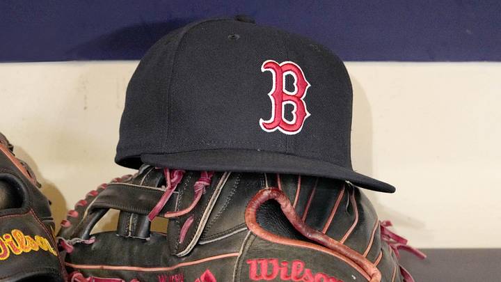 May 27, 2025; Milwaukee, Wisconsin, USA; A Boston Red Sox hat and glove sit in the dug out before a game against the Milwaukee Brewers at American Family Field. 